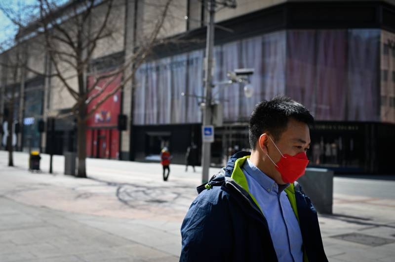 China reports 22 new virus deaths as imported cases rise