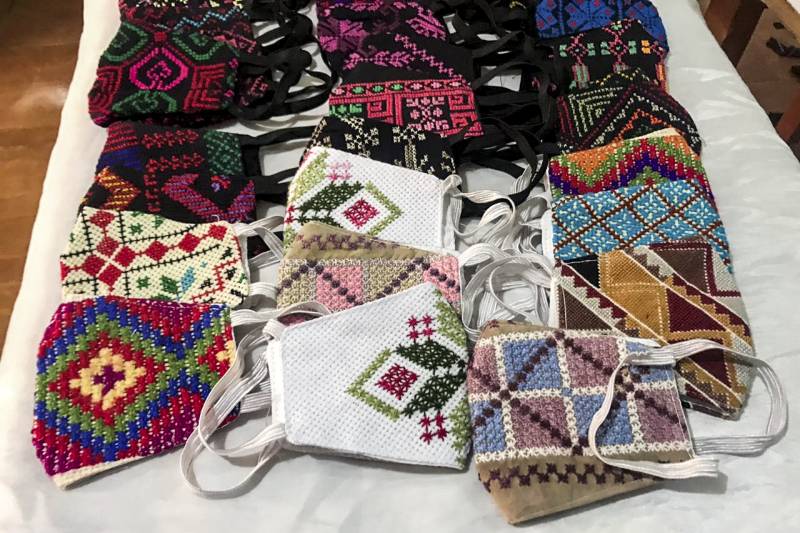 Women in Egypt's restive Sinai bring Bedouin embroidery to virus fight