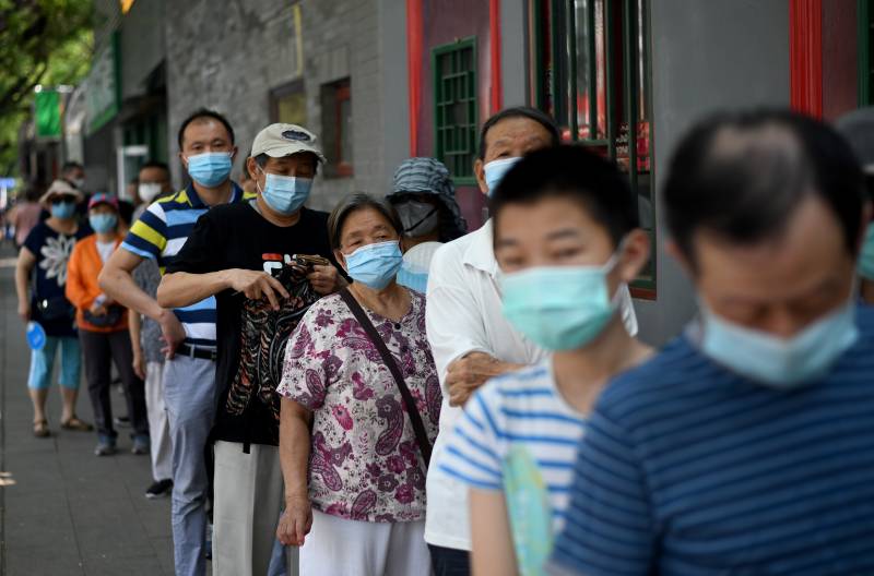 Beijing reports 22 new virus cases as millions tested