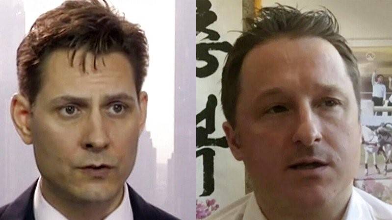 US demands that China free two charged Canadians