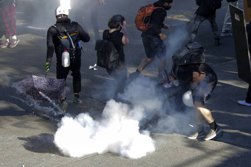 Protesters clash with Seattle police in latest outcry over US feds