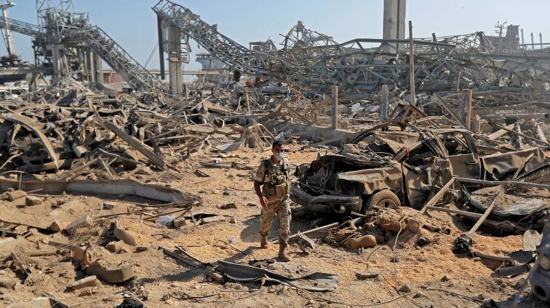Lebanon president says negligence or missile may have caused port blast