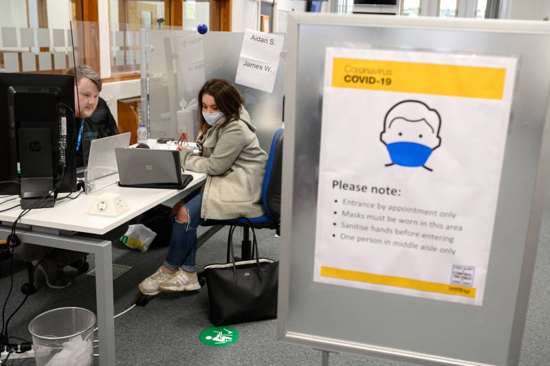 Despite virus threat, UK universities limit the damage