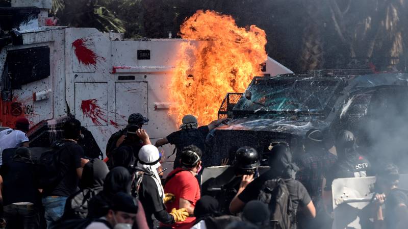 Churches burned as thousands mark Chile protest movement anniversary