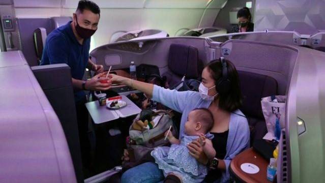 Travel-starved 'passengers' dine on parked Singapore Airlines jet
