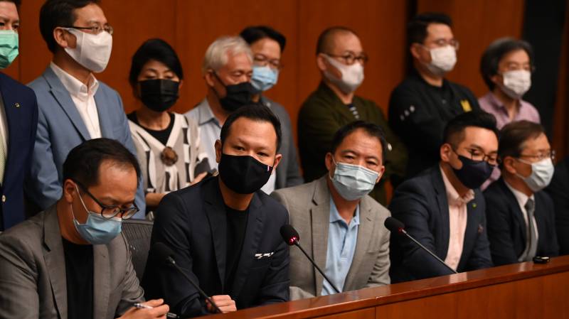 Hong Kong pro-democracy lawmakers threaten mass resignation