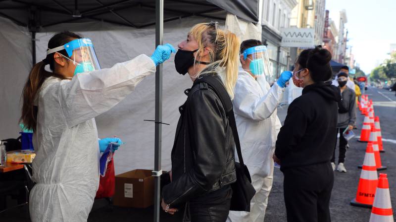 Tokyo tops 1,300 daily virus cases; warns of possible new emergency