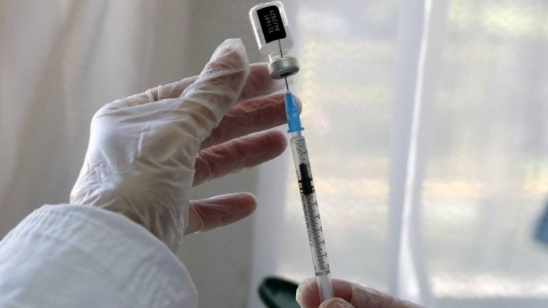 Japan plans mass virus jabs before Olympics: reports