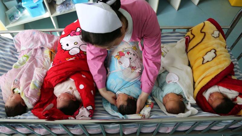 China allows couples to have three children as birthrate falls