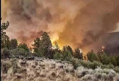 Wildfires rage across million acres as heat wave stifles western US, Canada