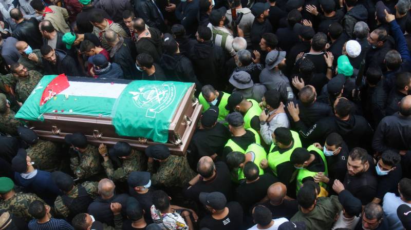 Mourners, including fighters, take part in a funeral procession for Hamza Ibrahim Shahin, a member of the Hamas movement ruling in the Gaza Strip, in the Burj al-Shamali camp for Palestinian refugees near the southern Lebanese coastal city of Tyre. AFP