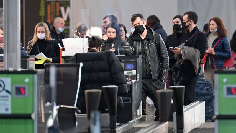 Travellers wait at the check-in counters ahead of their flights at the Boryspil airport some 30 kilimetres outside Kyiv. AFP