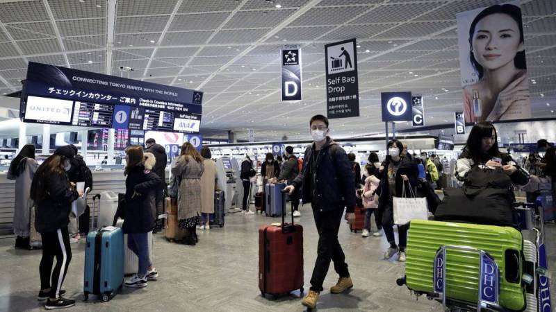 Japan eases virus border rules for visa holders, tourists still banned