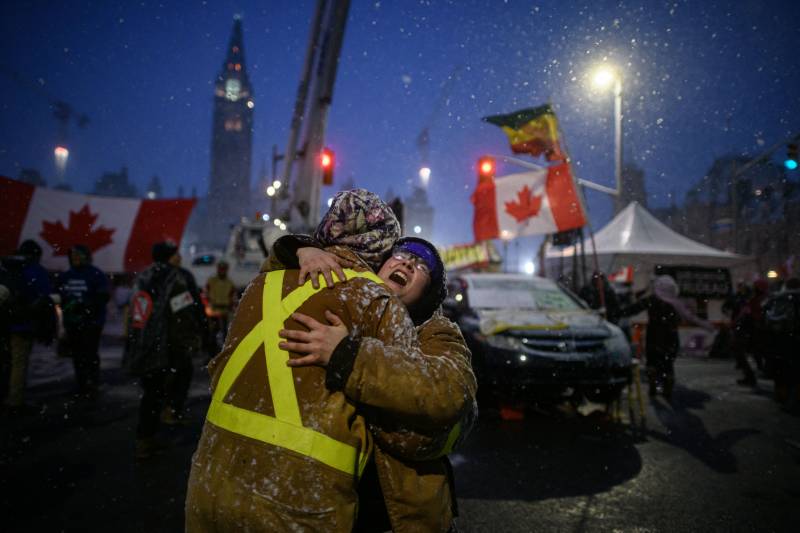 Canada's parliament cancels session as police set to clear protests