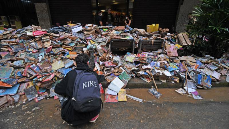 Thousands of damaged books are seen on the street after heavy rains flooded the bookstore in Petropolis, Brazil. AFP