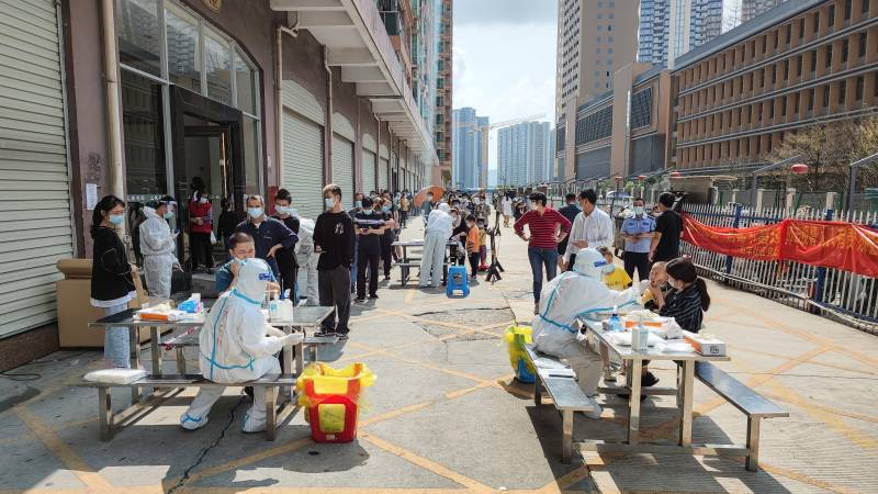 Residents queue to undergo nucleic acid tests for the Covid-19 coronavirus in Shenzhen, in China's southern Guangdong province. AFP