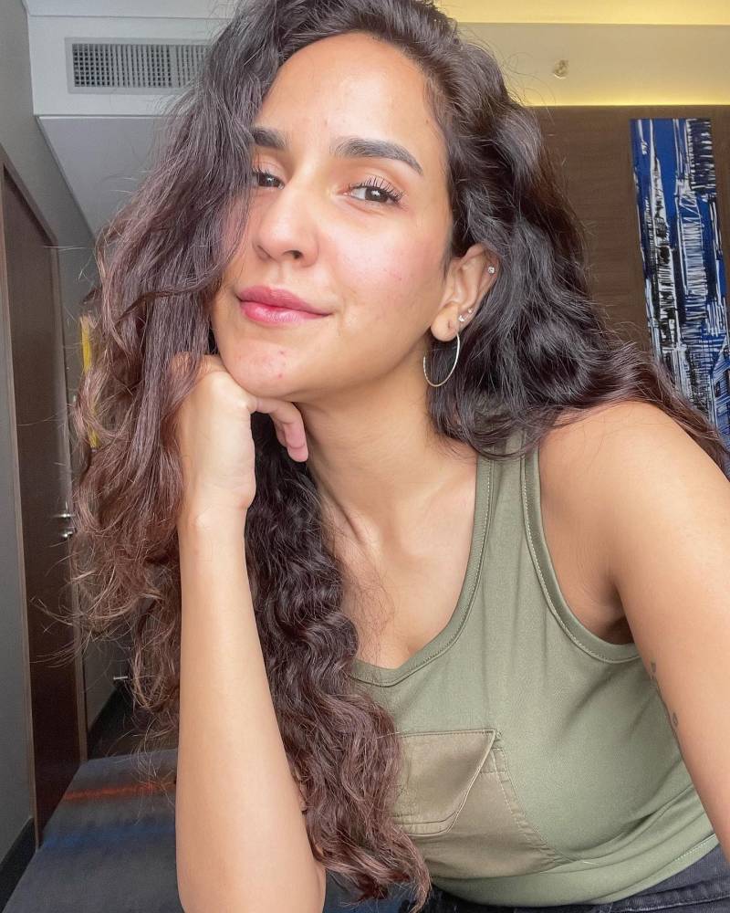 Anoushay Abbasi rocks web in orange plaid shirt