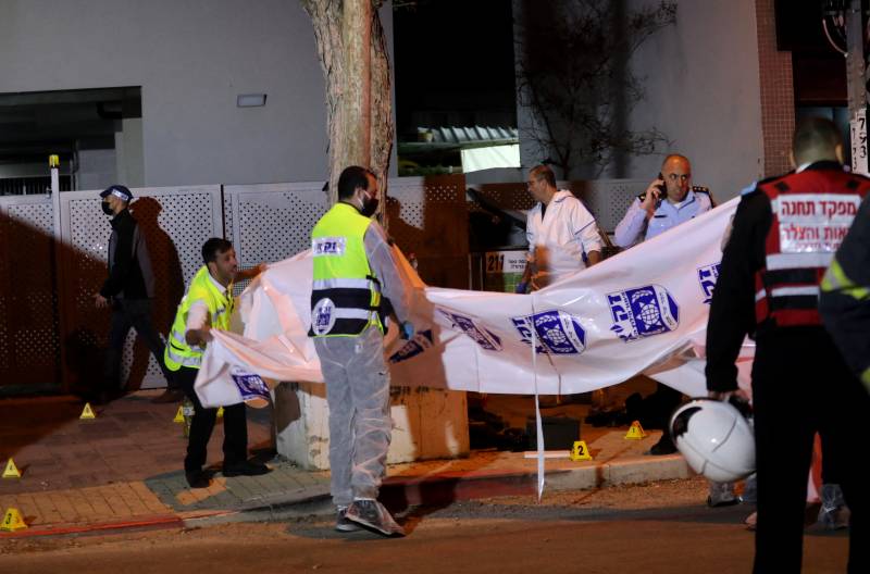 Israeli security forces gather at the site of an attack that left two Israeli police dead in the northern city of Hadera. AFP