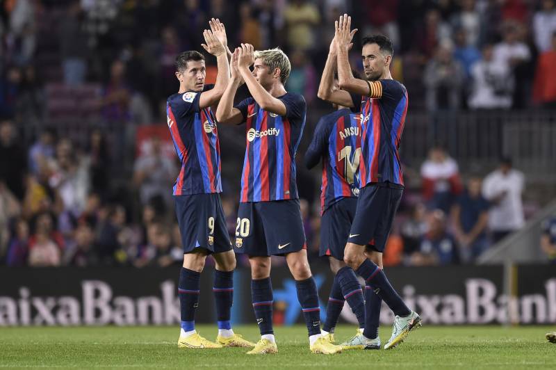 Barcelona players applaud at the end of the Spanish League football match between Barcelona FC and RC Celta de Vigo at the Camp Nou Stadium in Barcelona. AFP