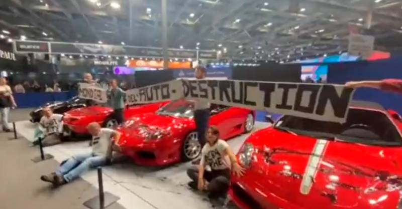 Climate activists target sports cars at Paris motor show