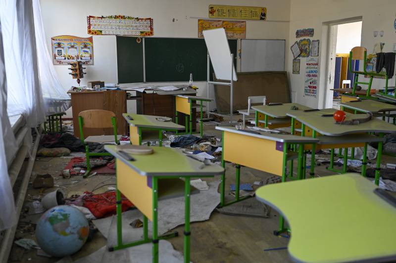 This photograph taken on November 1, 2022, shows a damaged class of the school building in the village, outside of Mykolaiv. AFP
