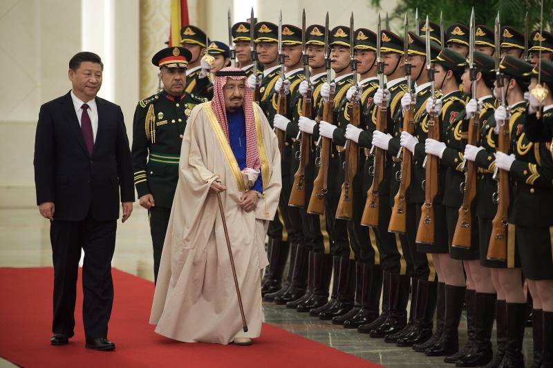 In this file photo Saudi King Salman Bin Abdul-Aaziz Al-Saud (C) reviews an honour guard with Chinese President Xi Jinping (L) during a welcome ceremony at the Great Hall of the People in Beijing on March 16, 2017. AFP