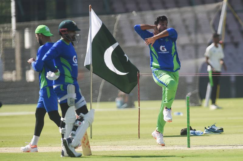 Pakistan's Zahid Mehmod (R) delivers a ball as Babar Azam (2L) looks on during the team practice session at the National Stadium in Karachi. AFP