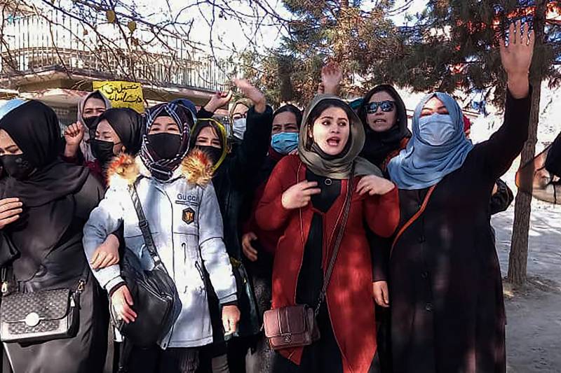 Afghan women chant slogans to protest against the ban on university education for women, in Kabul. AFP