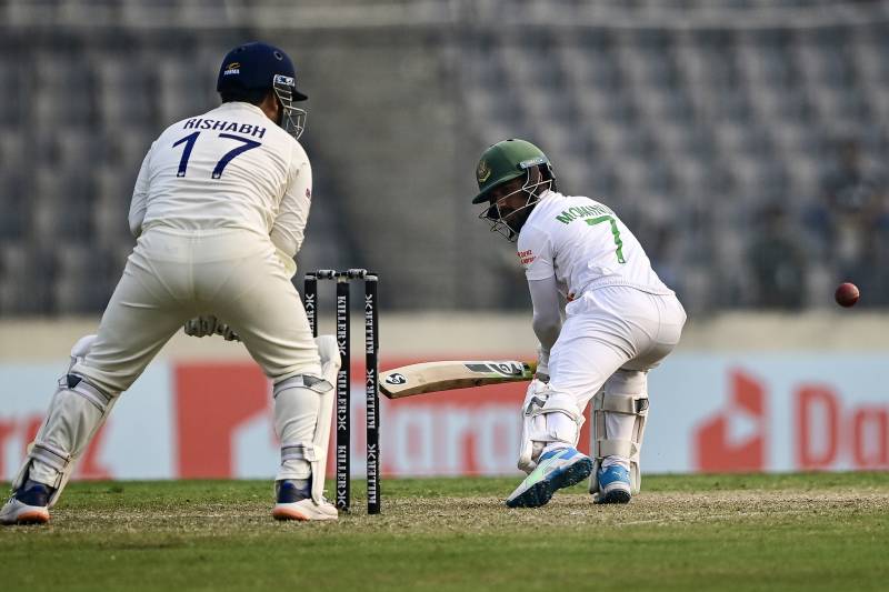 Bangladesh's Mominul Haque (R) plays a shot during the first day of the second cricket Test match between Bangladesh and India. AFP
