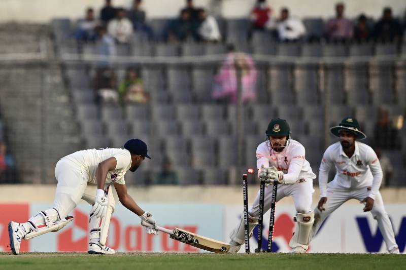 India's Mohammed Siraj (L) is clean bowled by Bangladesh's Nurul Hasan (C) during the second day of the second Test between Bangladesh and India. AFP