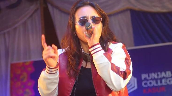 Who threw water on Natasha Baig during concert?