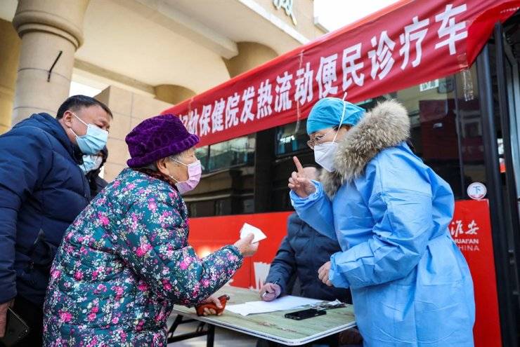 Xi urges steps to 'protect' lives as China battles Covid wave