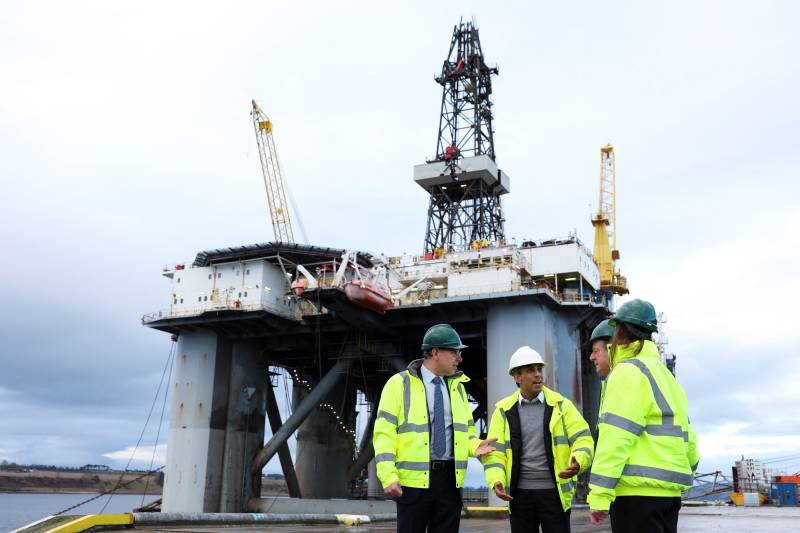 British Prime Minister Rishi Sunak (C) visits Port of Cromarty Firth in Invergordon, Scotland. AFP