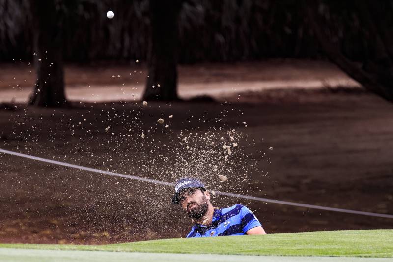Antoine Rozner of France competes during the Dubai Desert Classic 2022 Golf Championship at the Emirates Golf Club in Dubai. AFP