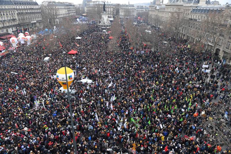 (FILES) In this file photo taken on January 19, 2023 demonstrators gather in Place de la Republique during a rally in Paris, as workers go on strike over the French President's plan to raise the legal retirement age from 62 to 64. AFP