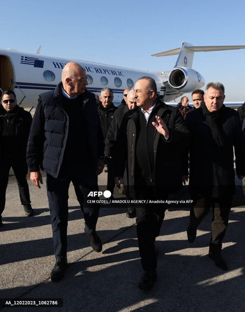 Turkish Foreign Minister Mevlut Cavusoglu (F-R) welcomes his Greek counterpart Nikos Dendias (F-L) at Adana Sakirpasa Airport after 7.7 and 7.6 magnitude earthquakes hit multiple provinces of Turkiye including Adana, Turkiye on February 12, 2023. AFP 