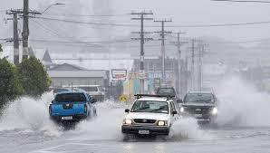 Thousands of homes in New Zealand were without power and flights were grounded as a tropical storm lashed the north of the country