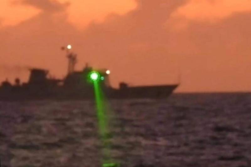 This handout photo taken on February 6, 2023 and released by the Philippine Coast Guard on February 13 shows a Chinese Coast Guard vessel shining a 