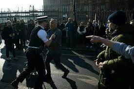 Six arrested as climate activists block road near UK parliament