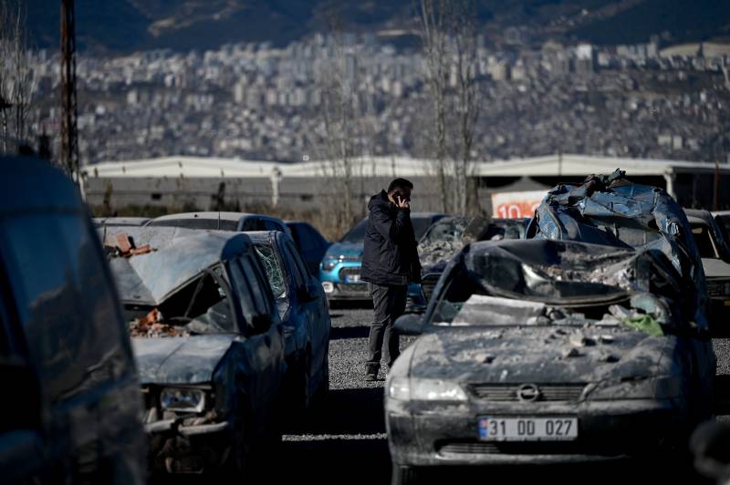 A man searches for his damaged car in Turkey’s Kahramanmaras. AFP