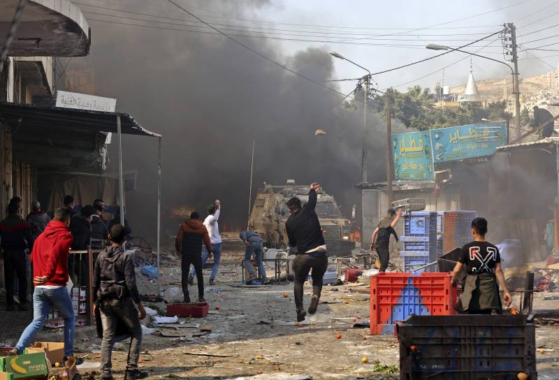 10 Palestinians killed, dozens shot in Israel West Bank raid
