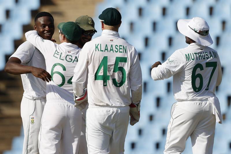 South Africa's Kagiso Rabada (L) celebrates with teammates after the dismissal of West Indies' Jermaine Blackwood (not seen) during the third day of the first Test cricket match between South Africa and West Indies. AFP
