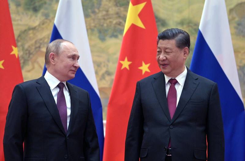 In this file photo taken on February 04, 2022 Russian President Vladimir Putin (L) and Chinese President Xi Jinping pose for a photograph during their meeting in Beijing. AFP 