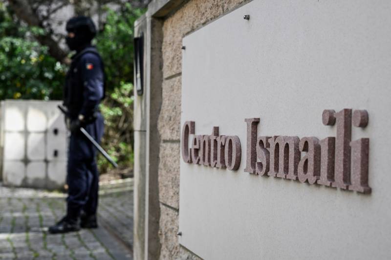 A Portuguese police officer stands guard at the Ismaili Islamic centre in Lisbon, after two people died following a knife attack that wounded several others. AFP