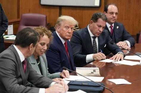 FACT FOCUS: Fake Trump mug shots spread in lieu of real one
