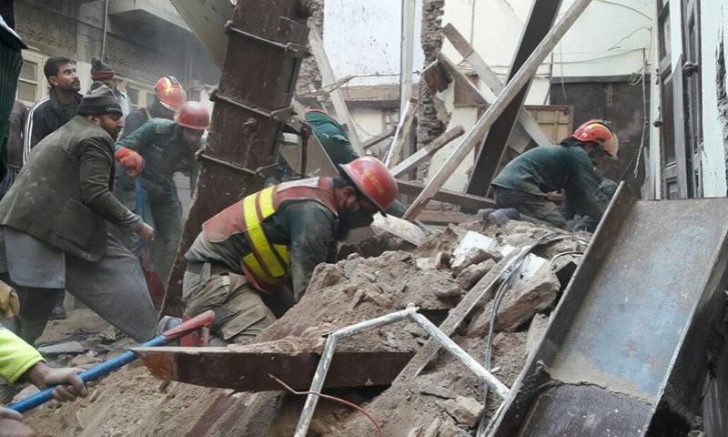 Two children die as roof of four-storey house caves in