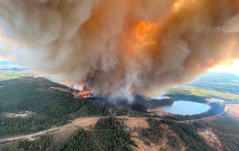 Wildfires in Western Canada force thousands to flee