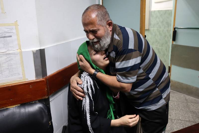 Relatives of Palestinian Islamic Jihad leader Jihad al-Ghannam, killed by an Israeli air attack at his home, mourn at Alnajjar hospital in Rafah refugee camp, southern Gaza Strip, on May 9, 2023. AFP 