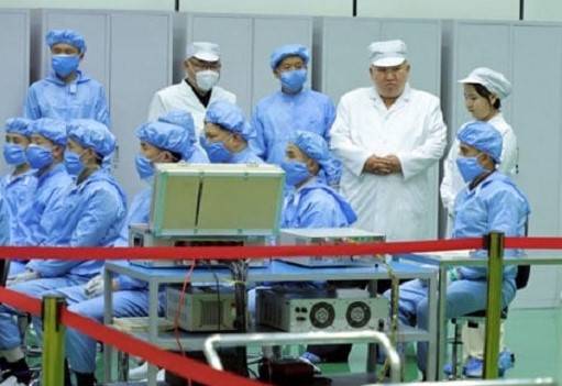 Kim inspects NKorea's first spy satellite