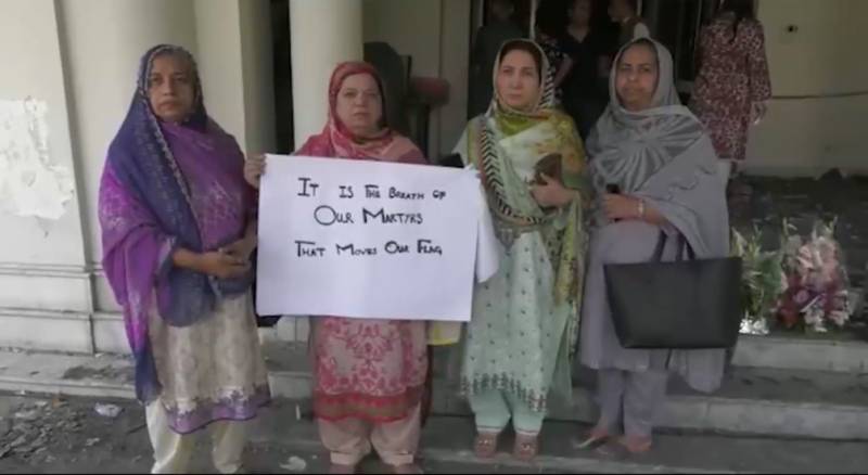 Families of martyrs cry tears of blood after visiting burnt Jinnah House